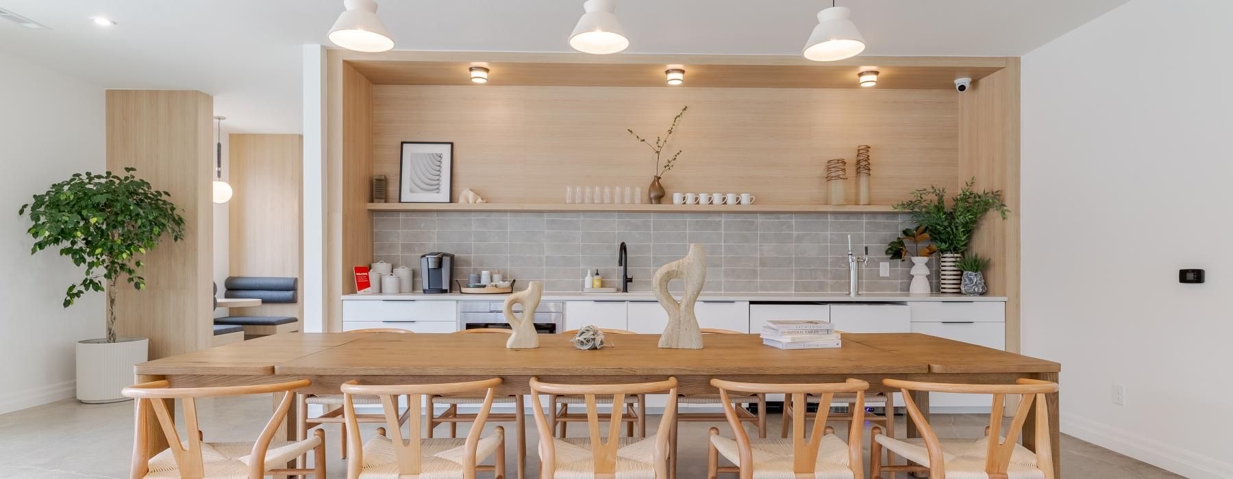 a kitchen with a bar and chairs