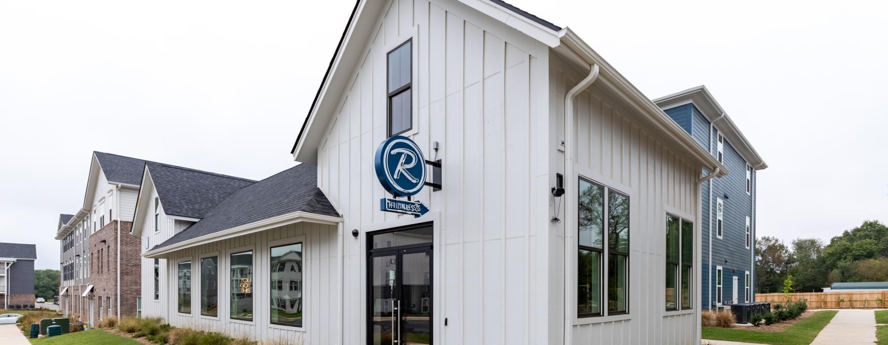 a white building with a sign on it