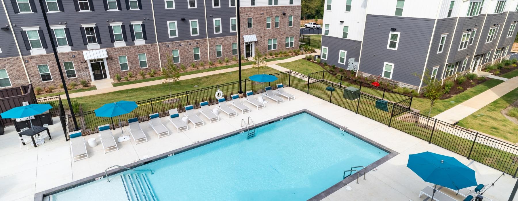 a swimming pool with umbrellas