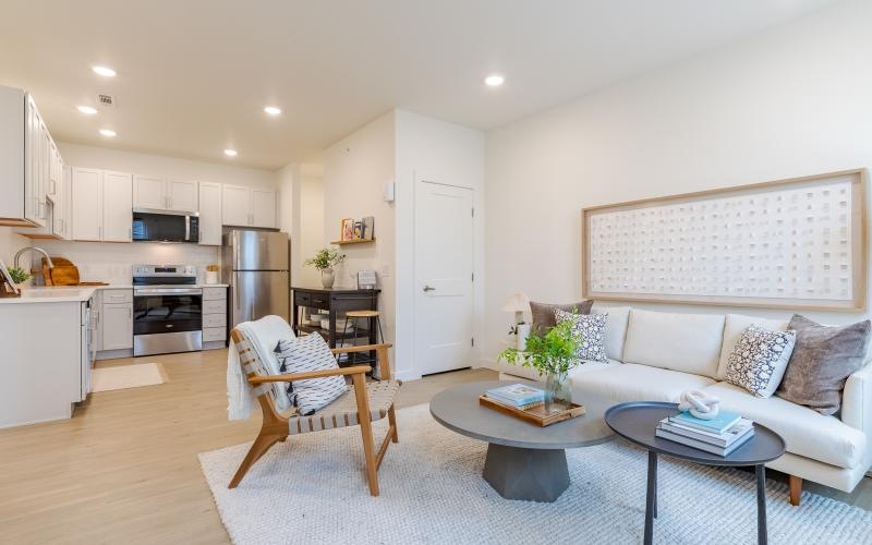 a living room with a couch and a table